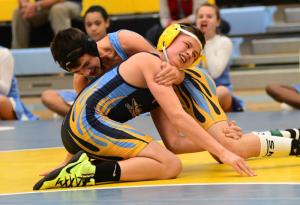 Beacon’s Merrick Harrigan-Ferro, right, works for a pin over Mariner’s Giovanni Guarino in the 124-pound class.