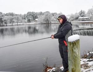 Kris Winsjansen, a Coast Guard member stationed at Indian River, tries his hand at bass fishing at Wagamons Pond. DAN COOK PHOTO