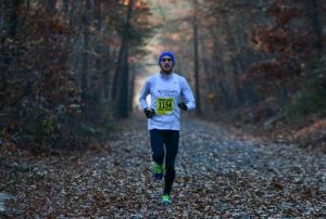 Jake Austin of Willow Street, Pa., runs down the trail toward Wolf Neck Road. He finished first in the half marathon with a 1:13:01.8. DAN COOK PHOTO