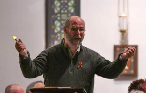Glen Pruitt shouts the words "You stupid darkness!" as part of his comments during the Service of Remembrance and Hope.