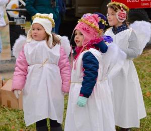 Three Bethel Christian School angels are ready to march in the parade. Their float won first place in the youth division.