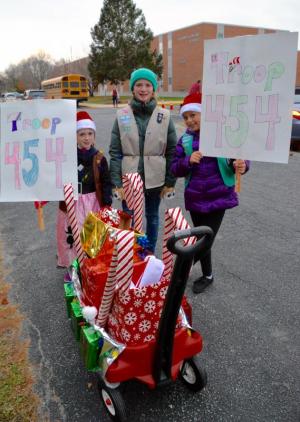 Girl Scout Troop 454 members, from the left, Gretchen Maughan, Gracie Maughan and Makhira Martinez are dressed and ready for the parade.