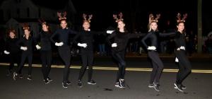 Coastal Dance Academy members do a chorus-line routine in front of the judges’ stand. The dancers won honorable mention.
