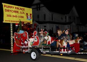 The Puppy Palace Doggie Daycare float is filled with – what else – lots of Christmas-dressed dogs. The float won second place in the commercial-float division.