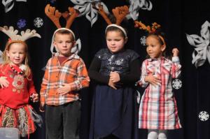 Pre-K students from the Lewes Center wear their reindeer antlers in their portion of the program. Shown are (l-r) Khloe Carrigg,
Luciana Crisci, Sariah Wright and Zoe Kemmerlin. Beach Babies Holiday