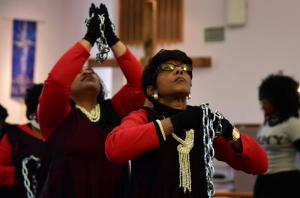 Doris Henry, front, and Lauren Burleigh of the dance group MZ Anointed dances to the song “Break Every Chain” at the MLK Worship Service.
