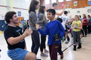 Cape 220-pound wrestler Billy Ott, left, gets a high-five from Halsey Sanchez-Fuentes after the Vikings sports presentation.
