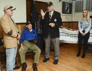 Paul Davis, president of Vietnam Veterans of America, right, and Delaware Commission of Veterans Affairs Commissioner Charles Baldwin, left, honor Bayard Horn. A Hero's Welcome Delaware member Rebecca Bristow is at far right.