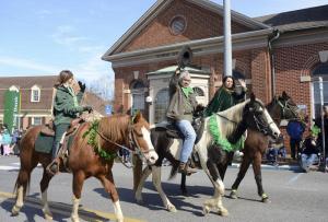 The Delmarva Chapter of American Mustang and Burro Association tips their hat to the crowd.