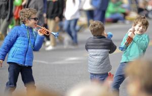 Kai Urrestarazu, left, toots his trumpet at brother Noa and Jay Curry.