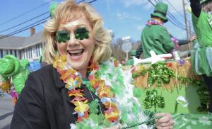 Dolores Pierce serves up a big grin behind green-tinted glasses on the Delaware Seashore Parrot Head Club float March 11 at the Milton St. Patrick’s Day Parade.