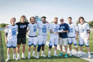 The Cape Class of 2018 presents a check for nearly $1,500 to Dan Cook for the Scott Brozey Lead by Example Memorial Scholarship. The team raised the funds through activities at the Tower Hill game May 3. Brozey was an All-American player for the Vikings in 2008. He was tragically killed in a pedestrian accident Sept. 30, 2016. The scholarship is presented to a senior who wishes to follow their dream of playing collegiate lacrosse. Shown are (l-r) Brandon Corder, Brooks Buck, Timmy Kelley, Aarin Burton, Liam Zolper, Cook, Jake Brown and Ryan Diacont. LARRY KUHN PHOTO