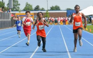 MOT Tigers athlete Lucas Hartley, 8, left, Sussex Riptides’ Bruno Camarco, 10 and Wilmington Wizards’ La’Majah Davis and Kayleah John, 10, finish the 100-meter dash.