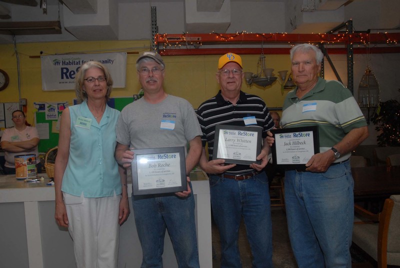 During the anniversary celebration volunteers and supporters were recognized for service to Habitat for Humanity. Shown with ReStore Manager Denise Jackson holding certificates of appreciation for their hours of volunteer time are (l-r) Jackson; Bob Roche, 1,100 hours; Larry Whitten, 1,300 hours; and Jack Hilbeck, 1,500 hours. BY STEVEN BILLUPS PHOTOS