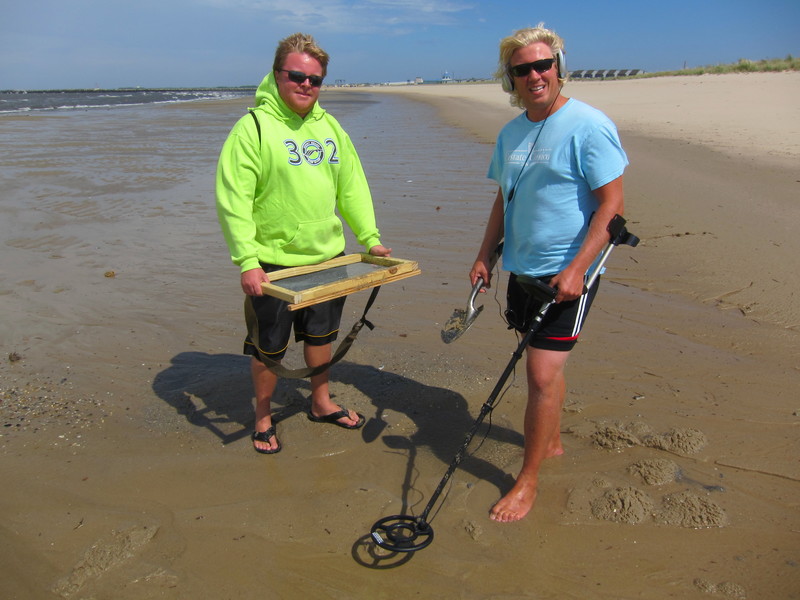 Dave Comer, left, and Nick Gregg, both of Middletown, took advantage of Sunday's extremely low tide at Lewes Beach to do some treasure hunting. "We're looking for some of that left over treasure from the DeBraak," said Gregg. "We figured that after the storm would be a good time to look. BY DENNIS FORNEY