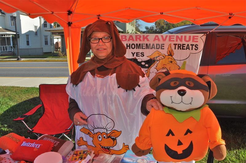 Denise Southard of Bark Avenue in Milton gets into the spirit of the season in a dog costume. She sponsored the pet costume contest. BY RON MACARTHUR