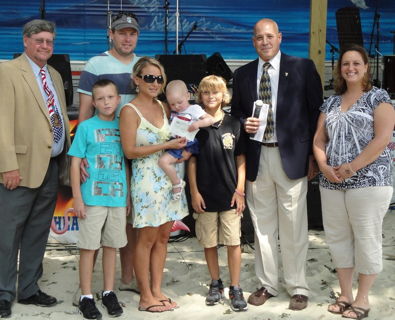 Attending the Elks Jernick Fund grant presentation award ceremony for Saylor Hayes at the Clam Jam in 2011 are (l-r) Cape Henlopen Elks Lodge No. 2540 Past Exalted Ruler John Loftus; Saylor's brother Gaige Hayes; her dad, Charles H. Hayes III; her mom, Nicole Lynn Hayes; Saylor Hayes; brother Cameron Hayes; Elks Lodge Leading Knight Stephen Pepe; and Elks Lodge Manager Christine Pepe. SOURCE SUBMITTED