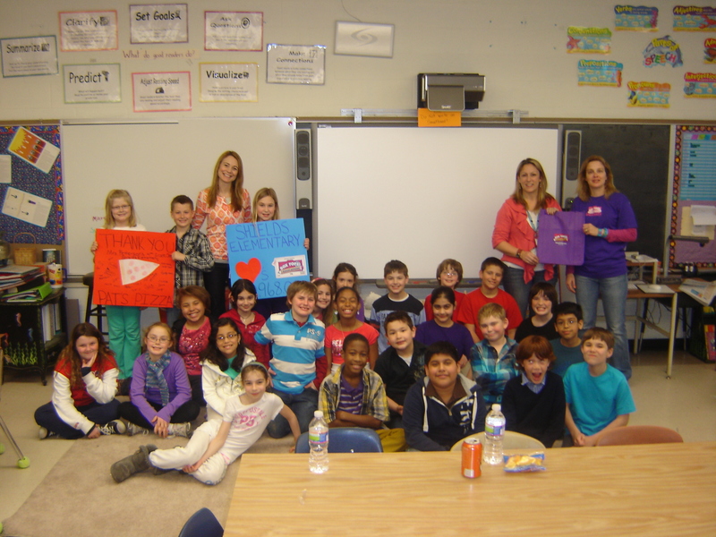 Hannah Petterson's fourth-grade class celebrates its contribution to the Shields fundraising campaign. Standing (l-r) are Autumn Davis holding sign with Tyler Ware; Jenny Nauman, principal; Lee Lee Wilson; Hannah Petterson and Carri Davis. Sitting in back are Grier Calagione (partially blocked), Sylvie Elliot, Tyler Clavette, Camp Steiner and Jacob Cunningham. In middle row are Vita Perry, Ava Nutter, Baxter Travers, Nayelis Navarro, Myles Mukasa, Prayosha Patel, Hunter Reifsnyder, James Ryan, and Ceasar Campos. In front are Jenna Fitzgerald, Maddie Betts, Emily Guttierez, Sydney Hollinger, Devon Kellog, Angel Ronquillo, Matthew Bodio and Tyler Stress. SOURCE SUBMITTED