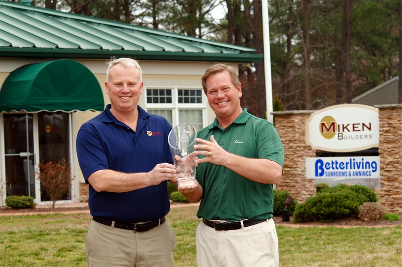 MIKEN Builders President Mike McKone, left, and founder and CEO Mike Cummings proudly display the company’s new BBB of Delaware Torch Award for Marketplace Ethics in front of their Millville headquarters on Cedar Drive. SOURCE SUBMITTED