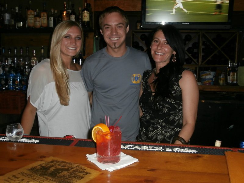 Katelyn and Zack King (l-r) are joined by Michelle Burris behind the bar at the Delaware Distilling Company opening. BY MOLLY MACMILLAN