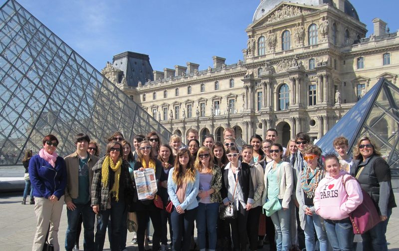 Visiting the Louvre museum in Paris with their Cape Gazette are a group of Cape students and teachers who visited France in April. Pictured in the back row are (l-r) Cape teacher Esther Kernosh, Devin Heron, Daniel Lewis, John Dean, Ben Lewis and Davielle Marsh. In the middle row are teacher Holly Criswell, Ethan Harrell, Kathleen Wright, Ingrid Hetfield, Elena Campbell, Elizabeth Sparks, Sarah Schlater, Lupita Haro-Simental, Raina Ebersole, Jacob Latta-Morissette, Gavin Jefferson and teacher Marissa DiSanto. In front are Julie Wilson, Leah Wilson, holding the Cape Gazette, Annie Leidy, Gabbie McNichol, Camryn Bernheimer, Rachel Meoli, Michele Bahtiarian, Maddie Kitchen, Sarah Herrmann, Shelby Murphy, Kayleigh Murphy and Hannah Tolbert. SOURCE SUBMITTED