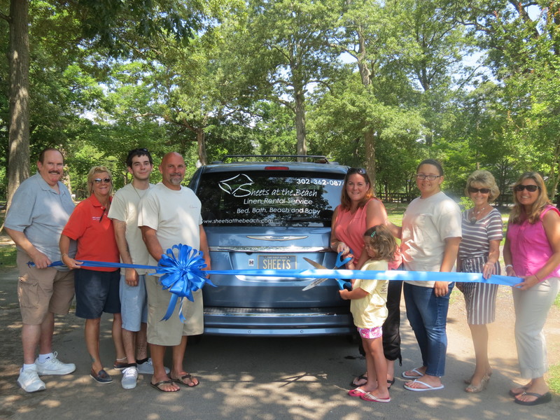 Shown at the Sheets on the Beach ribbon-cutting are (l-r) Terry Blackney, Sign*A*Rama; Katie Handy, Sign*A*Rama; Rick Bailey, Jim Zuber, Cali Keene, Vera Bailey, Elizabeth Zuber, all from Sheets on the Beach; and Carol Everhart, Rehoboth Beach -Dewey Beach Chamber of Commerce CEO; and Patty Burkentine, also from the chamber. SOURCE SUBMITTED PHOTO