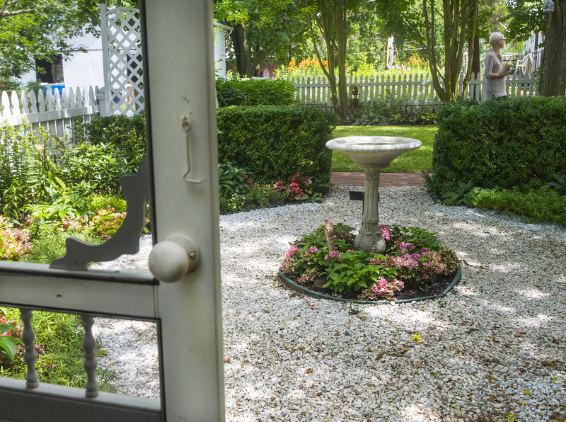 A gazebo in the back yard offers a private setting to enjoy the classic shady garden at the Federal Street federalist home of Roi Barnard and Stefan Lopathkiewicz. BY DENY HOWETH