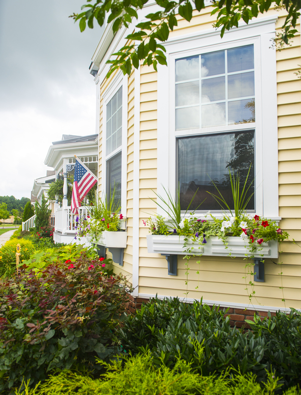 In Heritage Creek, Penny and Larry Gozzard do a lot with a small space and that includes window box displays all along the front of the house. BY DENY HOWETH