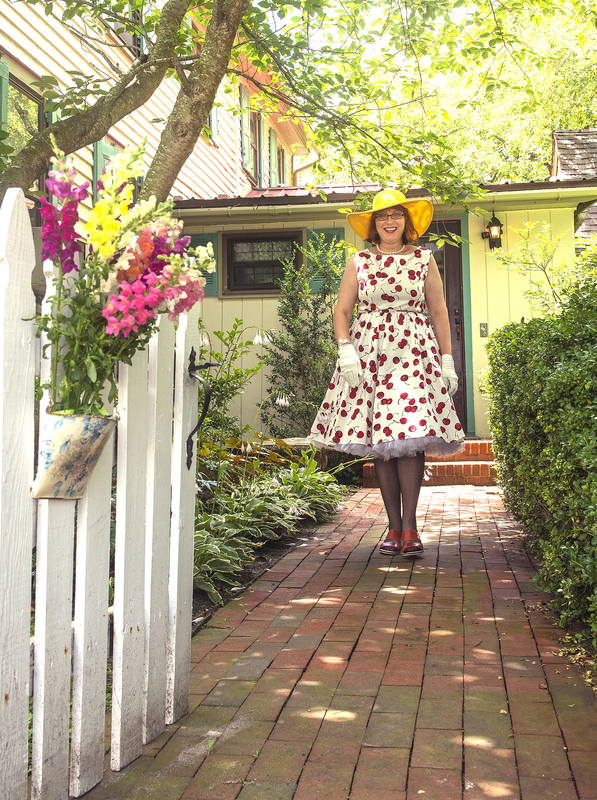 Brigitte Adams, garden supervisor at 412 Federal St., shows a bit of whimsey at the 19th century garden. BY DENY HOWETH