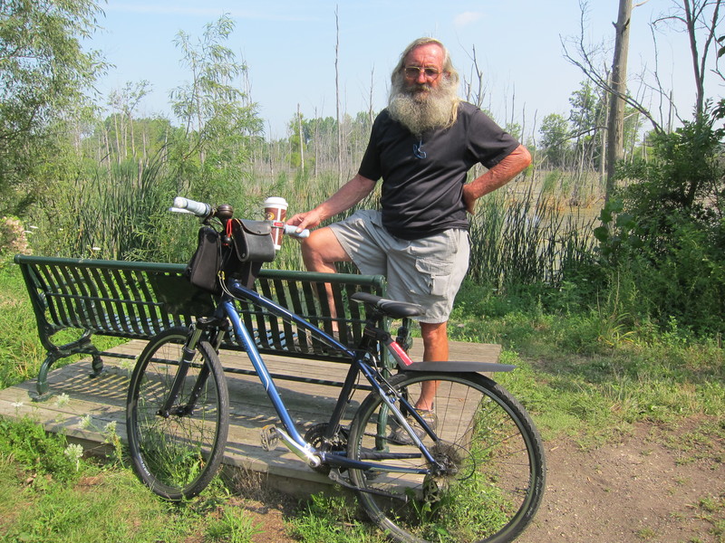 Bicycle Bob intercepted us at the McDonald's in downtown London, Ohio. He led us out of town to another trailhead all the while giving some town history and highlights. "This is where my family has lived for four generations," he said as we rolled through the tree-lined streets of a residential area. "I guess you've lived here pretty much all your life," I said. "Not yet," he said. Out on the trail he showed us a blue heron rookery. "There were 17 active nests there just a few weeks back." Another one of the great trail characters that have been so helpful. BY DENNIS FORNEY