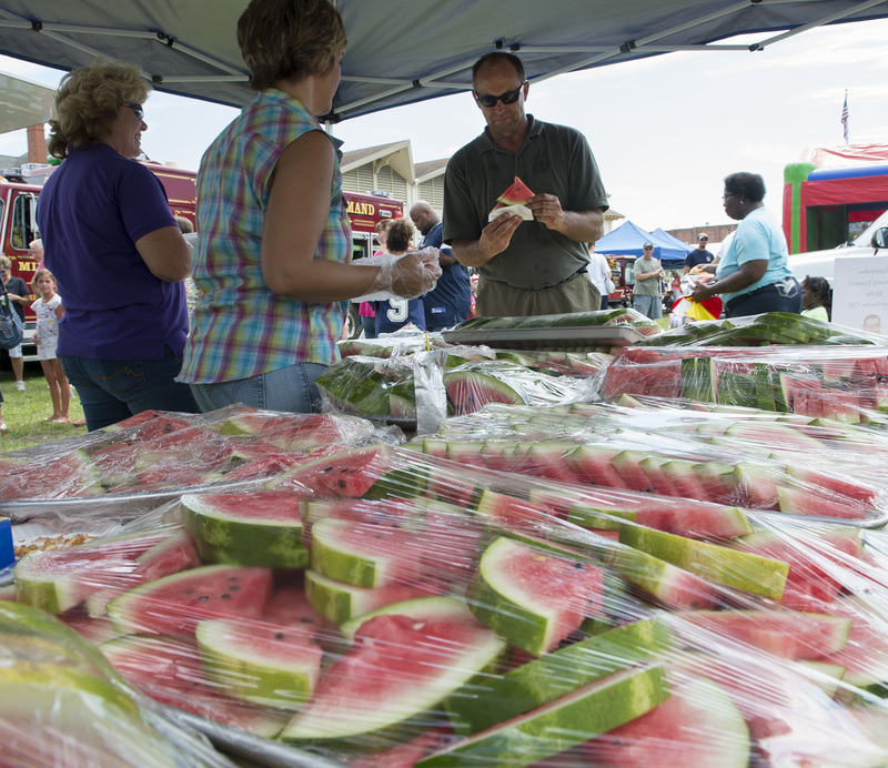 The Milton Garden Club supplied the watermelon, about a dozen cut & handed out for Family Fun Day. BY DENY HOWETH