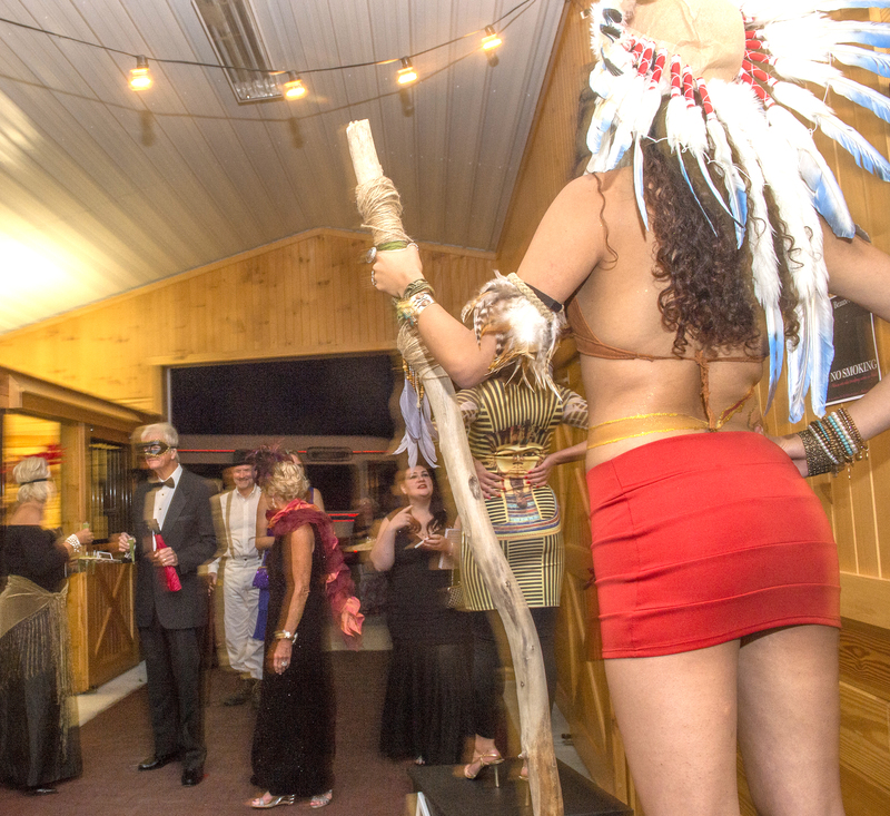 Revelers were greeted with a palatte of custom cocktails and models dressed in costume. BY DENY HOWETH