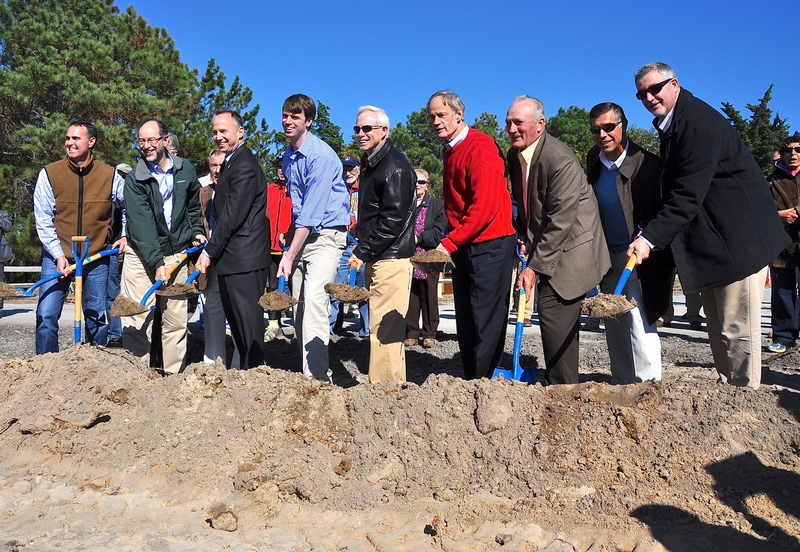 Politicians – and even some former legislators – gather to break ground to start construction of an extension to Gordons Pond Trail in Cape Henlopen State Park. Gathering for the event are (l-r) state Sen. Ernie Lopez of Lewes; DNREC's Director of Parks and Recreation Charles Salkin; former Rep. Roger Roy; Gov. Jack Markell; DNREC Secretary Collin O'Mara; former Rep. John Schroeder; U.S. Sen. Tom Carper; Rep. Dave Wilson, R-Bridgeville; state Rep. Steve Smyk, R-Milton; and state Rep. Tim Dukes, R-Laurel. BY RON MACARTHUR