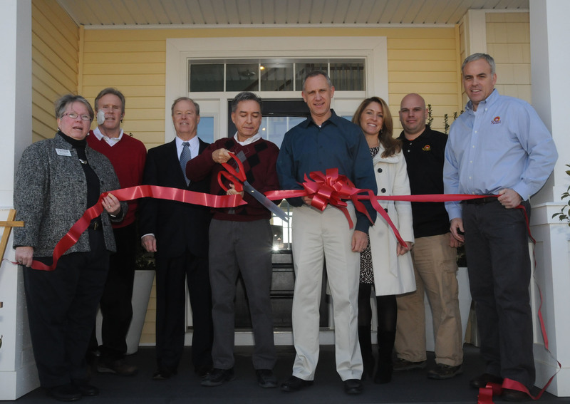A ribbon was cut Feb. 18 celebrating the sale of the 100th home at Senators in Lewes. New home owners Tony Forrest and Glyn Edwards were on hand to cut the ribbon celebrating the milestone that took 17 months to reach. Shown at the ribbon cutting are (l-r) Kathy Davison, Lewes Chamber of Commerce president; Paul Townsend, J.G. Townsend Jr. and Company and Jack Lingo Realtor; Bill Lingo, Jack Lingo Asset Management and Jack Lingo Realtor; Glyn Edwards and Tony Forrest, homeowners; Melissa O’Neil, Schell Brothers sale associate; Carmen Marinelli, Schell Brothers production manager; and Mark Fitzgerald, vice president of construction. BY STEVEN BILLUPS