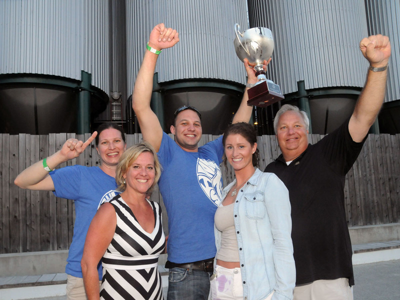 Raising the trophy in victory are the team from Jake's Seafood House. They defeated Pizza by Elizabeths in a highly competitive match. Jakes will donate its $1,000 to Special Olympics Delaware. The cup, which at the time of the photo was full of beer, will be proudly displayed in one of Jake's restaurants. Shown are (l-r) Michelle DeGrange, Delaware Restaurant Association CEO Carrie Leishman, Dan Klemkowski, Becca Stoffer and Jake's owner Bill Klemkowski. BY STEVEN BILLUPS