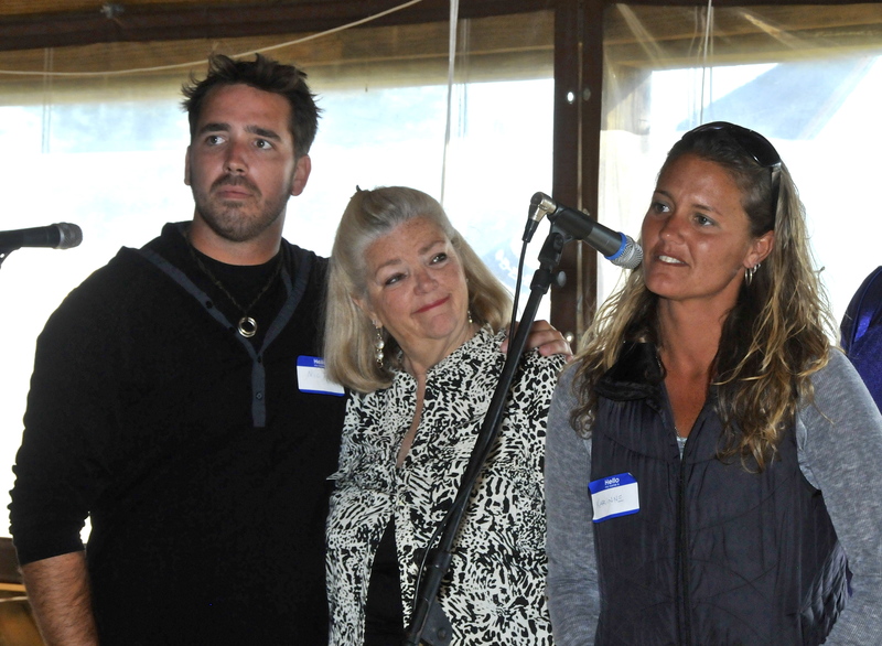 Dave's daughter, Karinne Lemmon, thanks the large crowd for attending as brother Nick Lemmon and aunt Cathy Parks look on. BY RON MACARTHUR