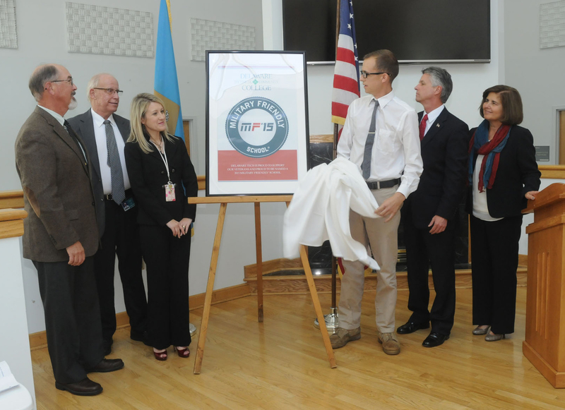 Shown at the unveiling of the Military Friendly plaque are (l-r) retired Col. John Tullis; retired Chief Bill Wood, Del Tech chief of Public Safety; Melissa Rakes, dean of student affairs; veteran Levi Valentine, Human Services student; Dr. Mark Brainard, Del Tech College president; and Dr. Ileana Smith, Owens Campus vice president and campus director. BY STEVEN BILLUPS