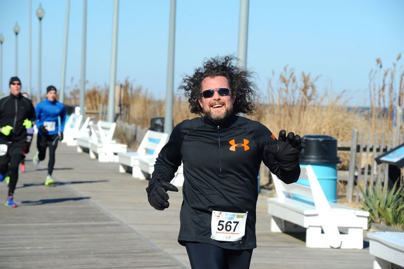 A hat or a lot of hair, gloves and glasses help the body retain heat. Regular runner Mike Firtch elects the mop top. BY DAVE FREDERICK