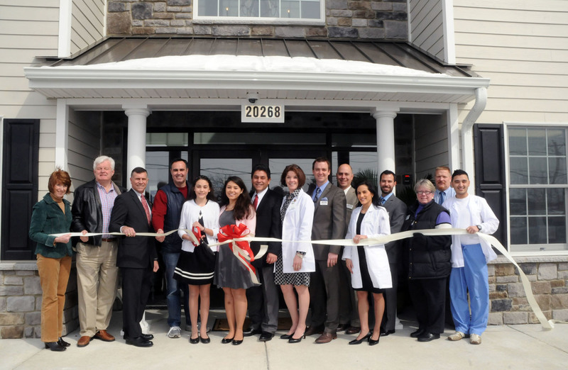 Shown at the ribbon cutting are (l-r) Betsy Reamer, Lewes Chamber of Commerce executive director; Lewes Mayor Ted Becker; Rep. Steve Smyk, R-Milton-Lewes; Sen. Ernie Lopez, R-Lewes; Fiona Pando; Oriana Pando; Dr. Jose Pando; Catherine Pando, RN; Tom Windley, Premier Physical Therapy; Pat Williams, Premier Physical Therapy; Jennifer Rahn, physicians assistant; Rick Beeson, Premier Physical Therapy director; Kathy Davison, chamber board president; Bill Hadder, Atlantic Massage; and Michael Malpass, billing. BY STEVEN BILLUPS