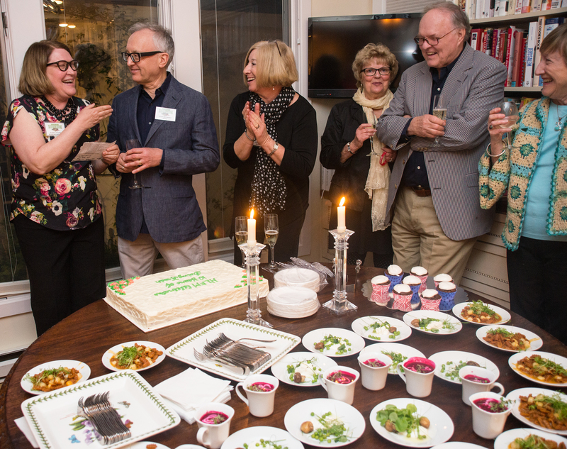 Nancy Staisey and Stan Divorski (left) are joined by guests for the cake cutting celebration. BY DENY HOWETH