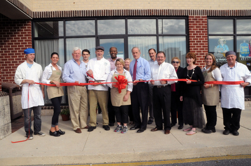 Shown at the ribbon cutting in back are (l-r) Tansh Papp, owners' son; friends Wesley and Mary Perkins; John Donato, Buttery owner; and Marilyn Lovely. In front are Paul Camarota, line cook; Rachel Murray, server; Lewes Mayor Ted Becker; Gary and Lorraine Papp, owners; U.S. Sen. Tom Carper; Bill Pfaff, Small Business Development Center; Betsy Reamer, Lewes Chamber of Commerce executive director; Randi Lee Marianano, bar manger; and Glen Atkinson, line cook. BY STEVEN BILLUPS