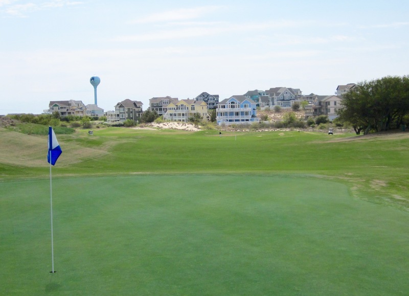 Looking downhill from the No. 1-handicap hole at The Currituck Club on the Outer Banks, the 370-yard uphill dogleg right 12th. The beautiful houses in the background call to mind the Painted Ladies in San Francisco - if those homes were 5,000 square feet and tucked behind sand dunes, instead of at Hayes and Steiner streets in Haight-Ashbury. BY FRITZ SCHRANCK