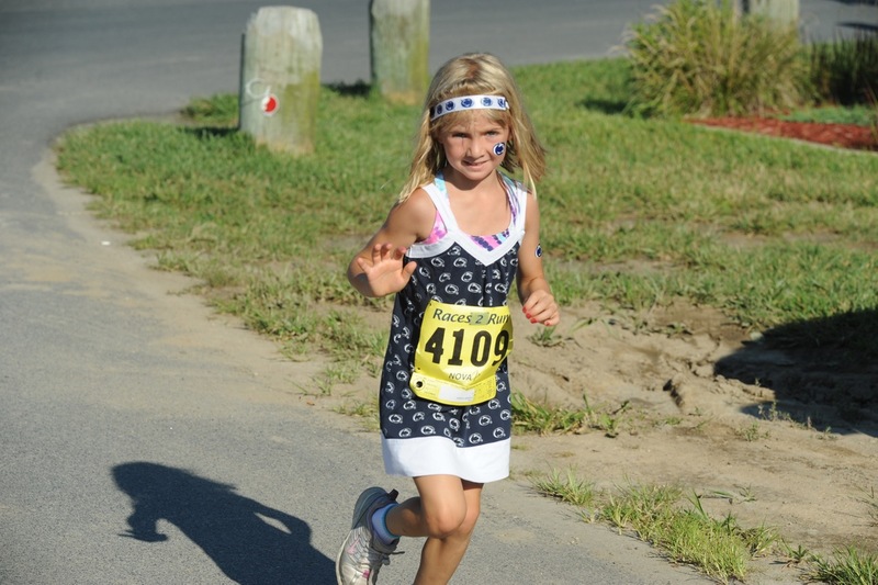 "Hey Lucyann, what's your game? Can anybody play?" Lucyann Kaufhold, 7, of Landisville, Pa., ran like 36 minutes. "She just loves to run," said her mother Theresa. Lucyann is sporting her Nittany Lions action wear. BY DAVE FREDERICK