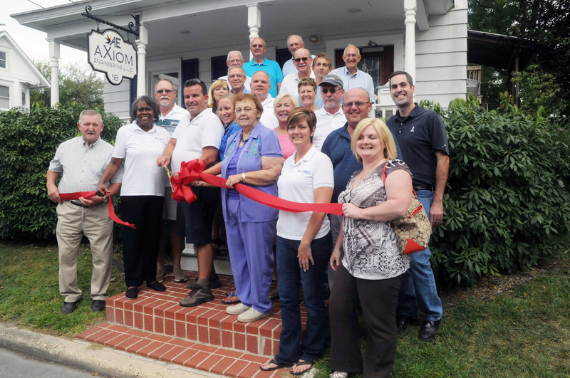 Shown at the ribbon-cutting in back are (l-r) Mike Vincent, Sussex County Council; and Rep. Dave Wilson, R-Bridgeville. In the third row are Rep. Harvey Kenton, R-Milford; Ray Hopkins, Georgetown Rotary Club; Ryan Bradley, survey technician; and Randall Cash, Georgetown Chamber of Commerce. In the second row are Scott Wallis, P.L.S., chief of surveys; Heather Pleasants, Milford Chamber board member,; Rep Rich Collins, R-Millsboro; Mike Voeltner, Cadd manager; Rep. Ruth Briggs King, R-Georgetown; Chris Lecates, Georgetown Town Council; Bob Rosenberger, senior project manager; Bill West, Georgetown mayor; and Jon Bell, Better Business Bureau. In front are Sam Wilson, Sussex County Council; Edna Wilson, receptionist; Ken Christenbury, P.E., president; Carolyn Christenbury; Helen Kruger, Georgetown Chamber membership representative; Debby Bradley, bookkeeper; and Angie Emerson, Georgetown Chamber of Commerce. BY STEVEN BILLUPS