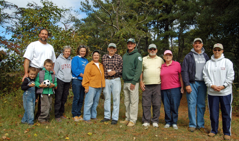 Volunteers with the Friends of Holts Landing State Park (l-r) Laf Erickson with his two boys, 4-year-old Gunnar and 6-year-old Karl, Patty Moulder, Melinda Duryea, Frances Hart, Chuck Schonder, Doug Long, Chuck King, Maggie King, Dave Gannona and Linda Kent cleaned up trails at the park Oct. 10. BY MADDY LAURIA