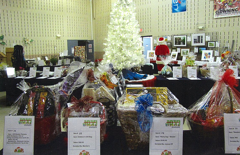Items from last year's Christmas Joy! 365 silent auction fill the room. The silent auction is the major fundraiser for Epworth's year roundprogram which assists local families throughout the year by providing funds for personal items, youth programs, and housing assistance as well as continuing the tradition of the Christmas holiday family mission which will provide 80 families with clothing and toys for the children and a Christmas dinner food basket. SOURCE SUBMITTED
