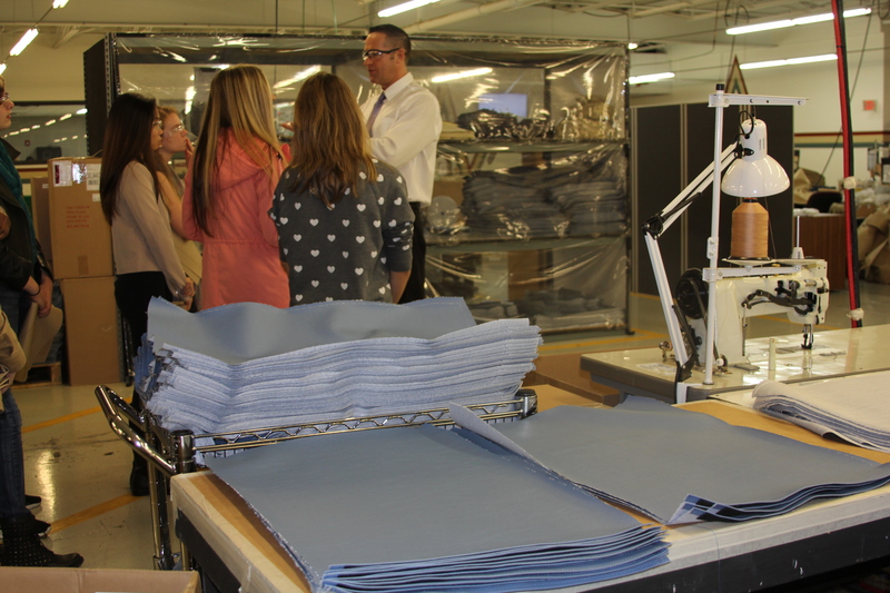 Stacks of blue vinyl squares are destined for seat covers on Washington, D.C's, Metro railway after employees at First State Manufacturing stitch them together. BY MELISSA STEELE