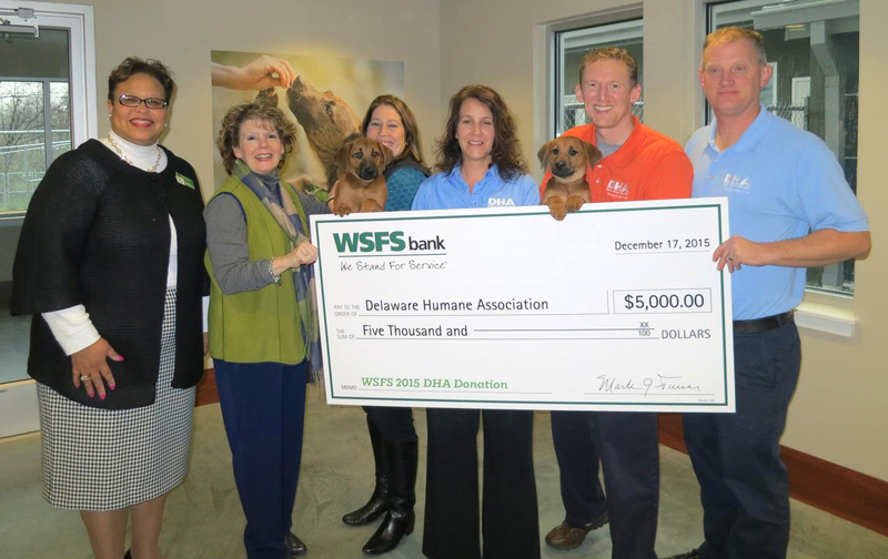 Shown are (l-r) Vernita Dorsey, vice president and director of community strategy for WSFS; Peggy Eddens, executive vice president and chief human capital officer; DHA puppy Randy; Cortney Klein, vice president, director of advertising and communications; Debra Radcliff, DHA director of operations; DHA puppy Michael; Greg Munson, DHA director of development and major gifts; and Patrick Carroll, DHA executive director. SOURCE SUBMITTED