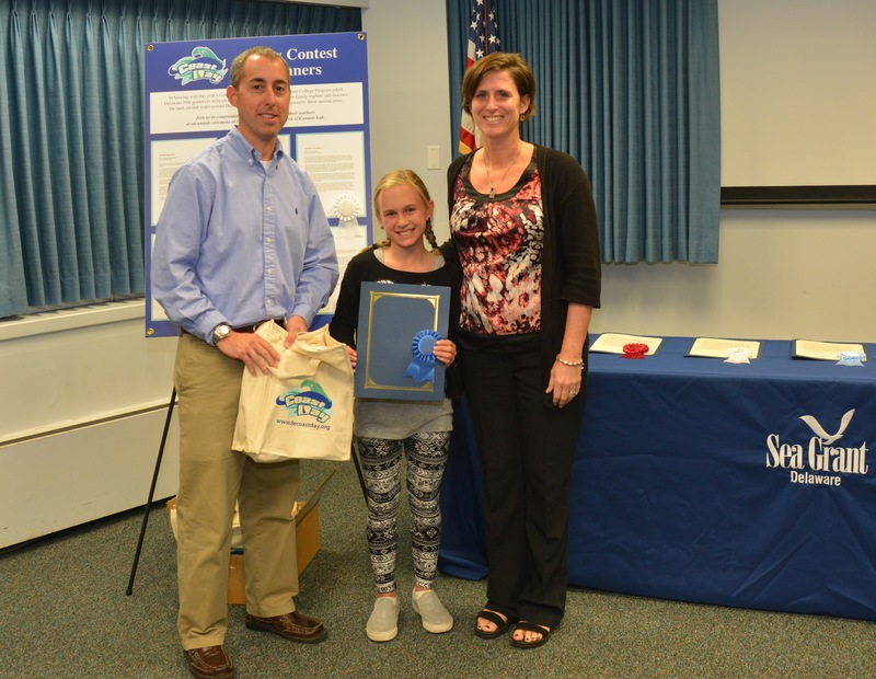 Education specialist Chris Petrone, left, with first place winner Emma White and her teacher Ms. Robin Hall from Southern Delaware School of the Arts. SOURCE SUBMITTED