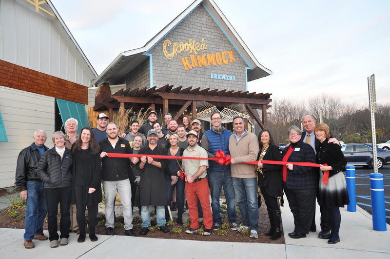 Shown are (l-r) Lewes Councilman Dennis Reardon; Lewes Councilwoman Bonnie Osler; Lewes Mayor Ted Becker; Lewes Chamber of Commerce Board Director Jen Mason; Crooked Hammock staff members, Craig Parmenter, Tommy Little, Chris Thompson, Alyssa Moore, Andy West, David Halloran, Kyle Collins, John Wilkinson, Ryan White, Devon Miller, Zach Diogo, Jen Chase, Crooked Hammock owner and General Manager Rich Garrahan, Head Brewer Chris Wright and owner Josh Grapski; Sen. Ernie Lopez, R-Lewes; Lewes Chamber of Commerce Treasurer Nikki Fisher; Chamber Board Director Kathy Davison; Rep. Pete Schwartzkopf, D-Rehoboth Beach; and Lewes Chamber of Commerce Executive Director Betsy Reamer. BY NICK ROTH